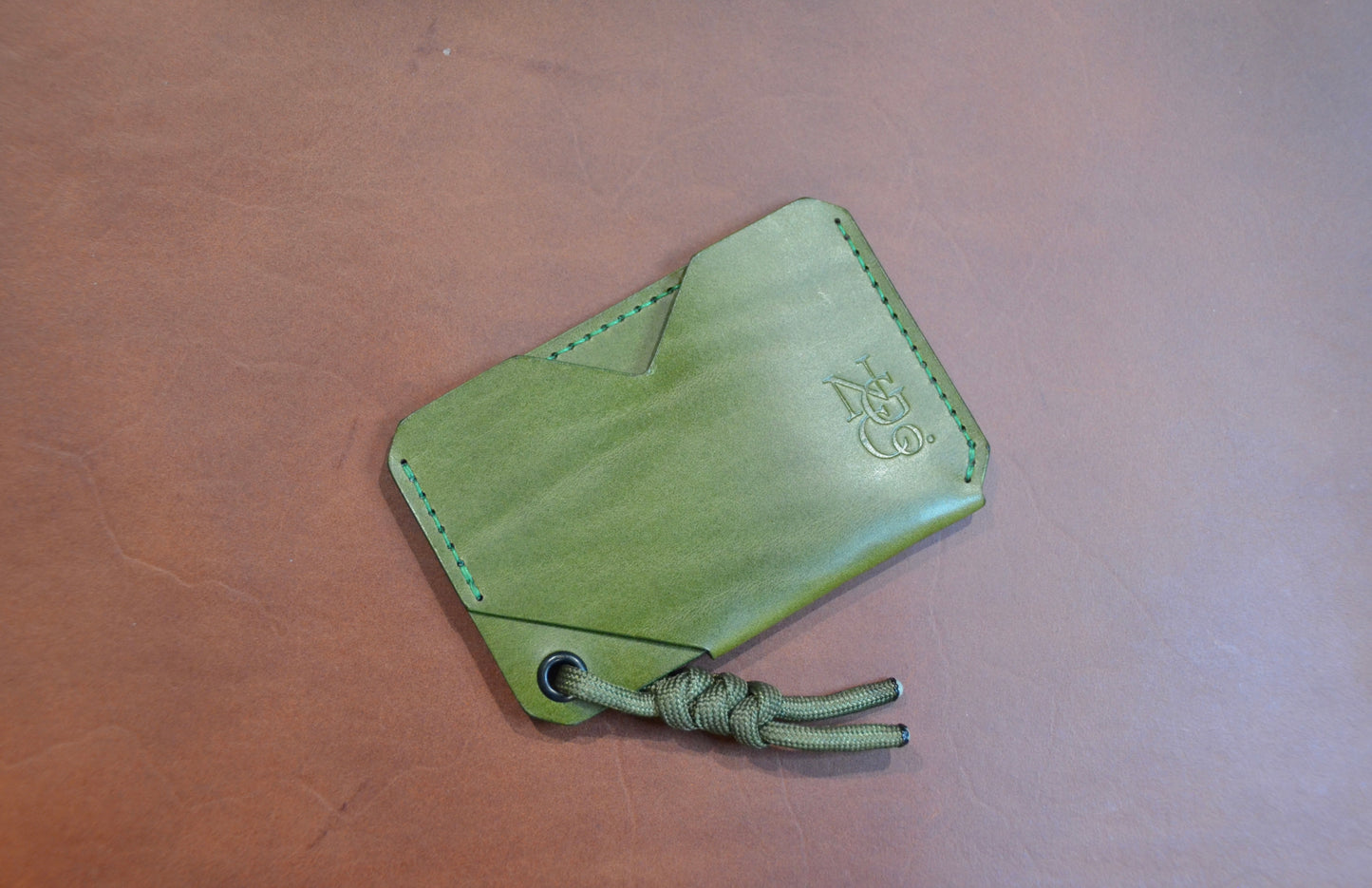 EDC V.2 handmade leather wallet in olive color, featuring a minimalist design with two pockets.